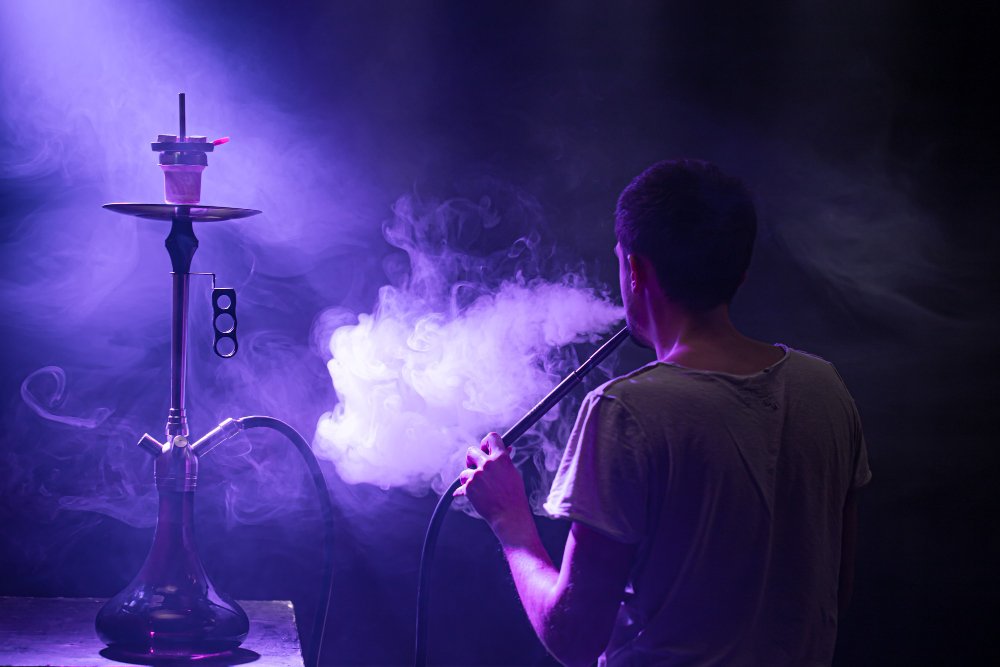 man-smoking-classic-shisha-beautiful-colored-rays-light-smoke-concept-hookah-smoking