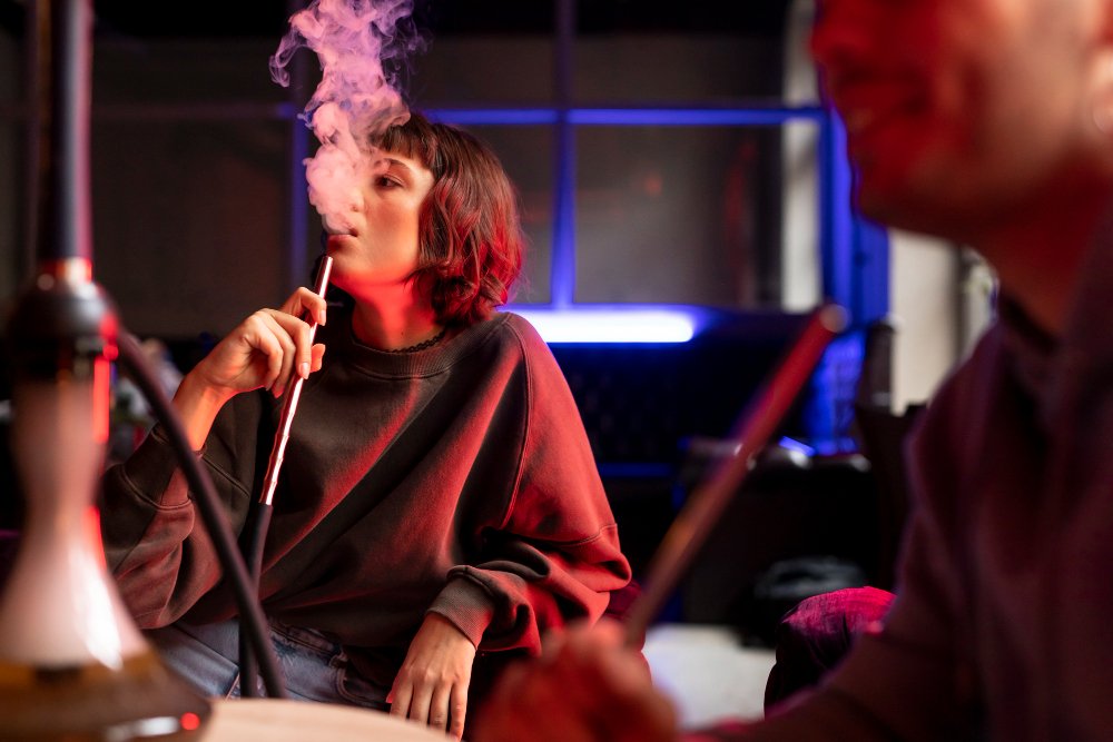 young-man-woman-vaping-from-hookah-indoors (2)